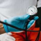 physician checking for high blood pressure